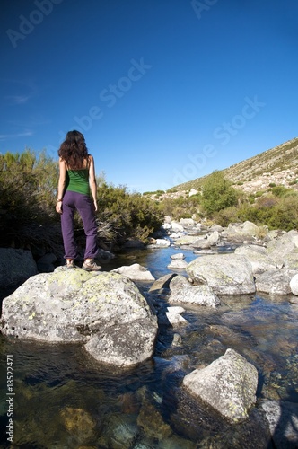 rock in the river with woman