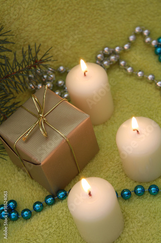 Christmas candles on green background