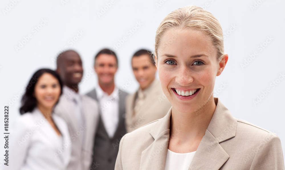 Portrait of smiling businesswoman in front of her team Portrait of smiling businesswoman in front of her team
