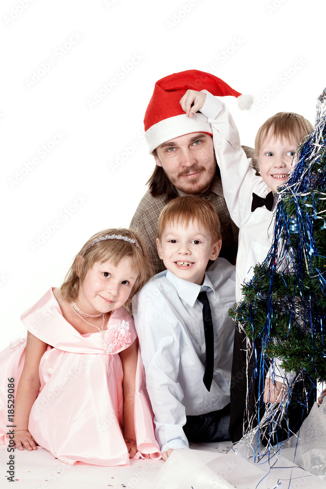Family near to a New Year tree Family near to a New Year tree