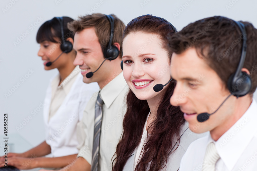 Woman working with more people in a call center Woman working with more people in a call center