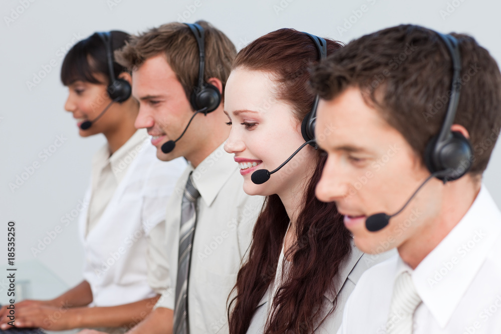 Manager working with his team in a call center Manager working with his team in a call center