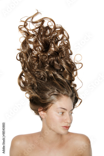 Isolated portrait of the girl with long curly hair