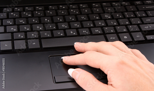 woman hand on laptop keyboard