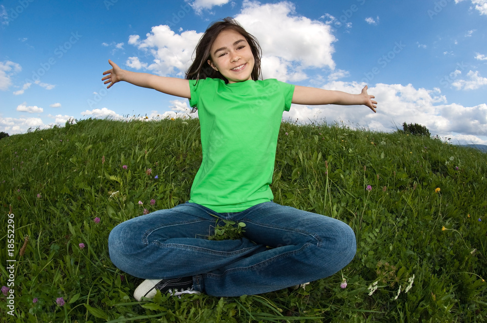 Girl relaxing on green meadow Girl relaxing on green meadow