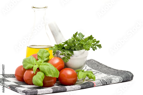 Fototapeta Naklejka Na Ścianę i Meble -  bottle of olive oi, tomatoes, basil and parsley