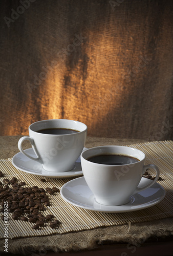 Close-up of a wonderful two cups of hot coffee