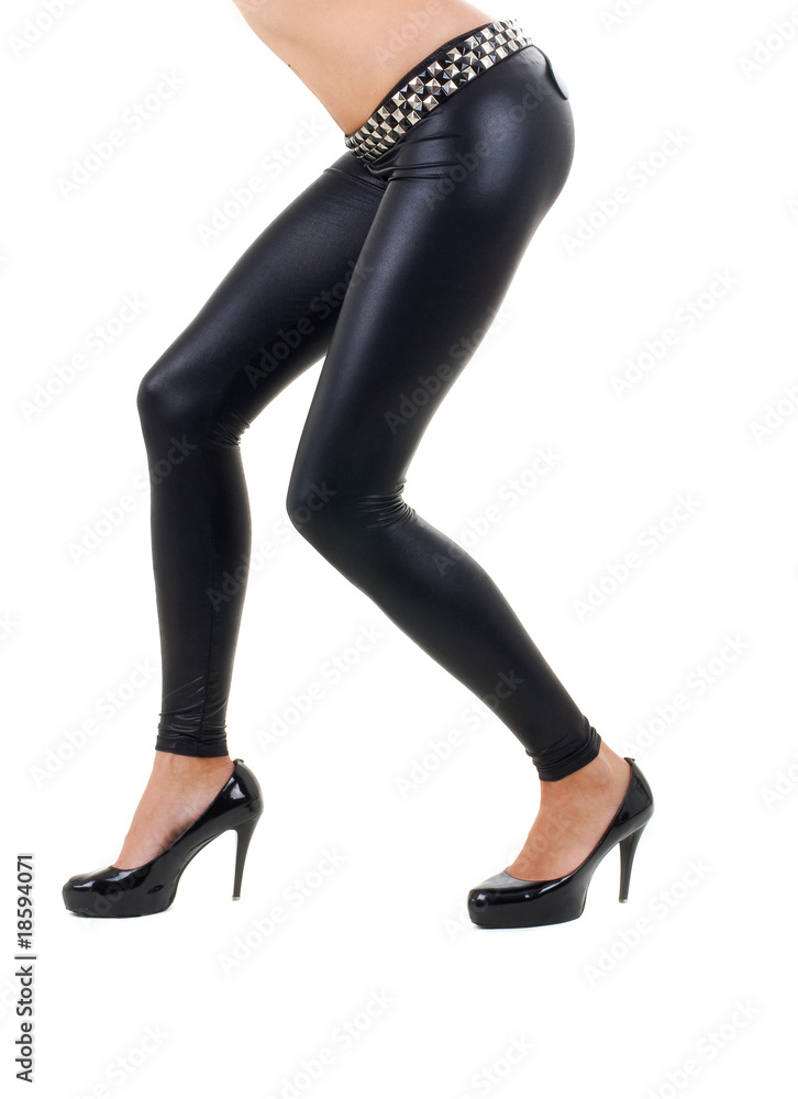 female legs in high heel shoes isolated on a white background female legs in high heel shoes isolated on a white background