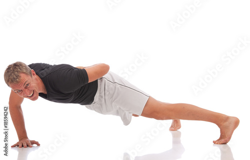 sporty guy doing one arm push ups