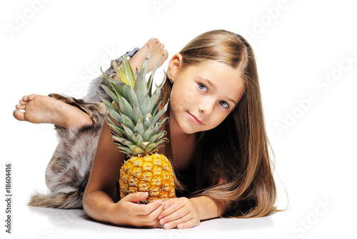 Little girl with pineapple