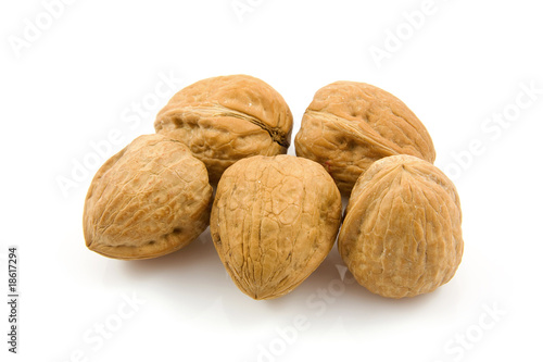 some walnuts over white background