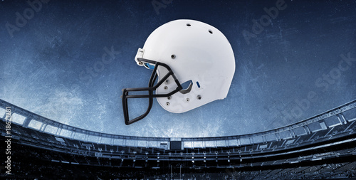 Football Stadium Background with Helmet photo