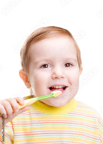 smiley boy cleans a teeth isolated