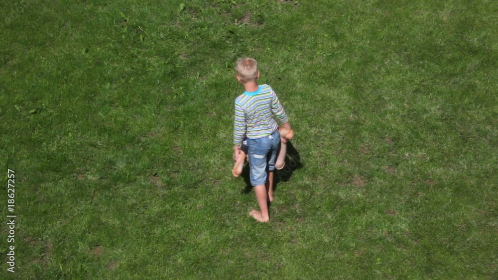 two boys playing wheelbarrow two boys playing wheelbarrow