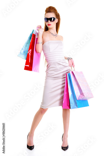 Pretty woman with purchases in hands