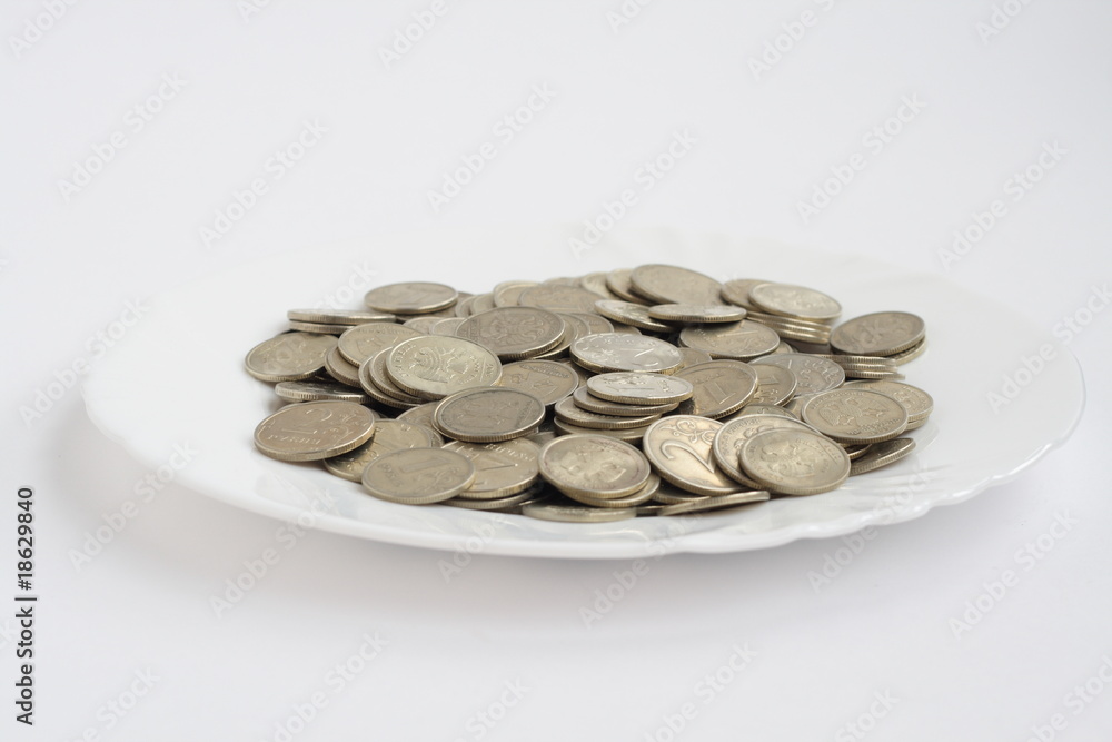 plate of coins isolated on white background plate of coins isolated on white background