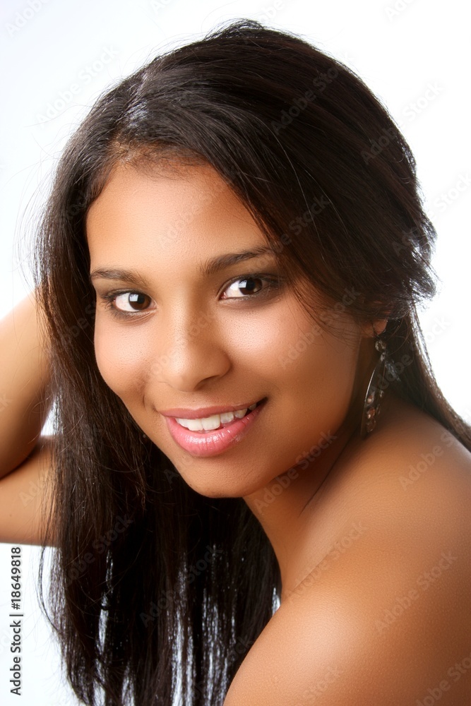 Obraz premium Beautiful young black girl with huge smile on white backdrop