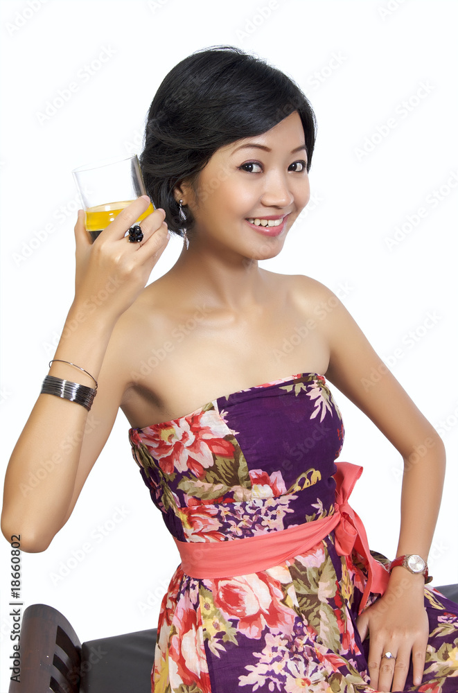 Beautiful Woman Drinking Orange Juice While Sitting Beautiful Woman Drinking Orange Juice While Sitting