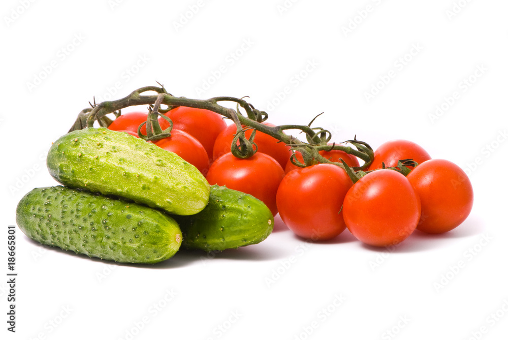 Fresh tomatoes and cucumbers on studio white background. Fresh tomatoes and cucumbers on studio white background.