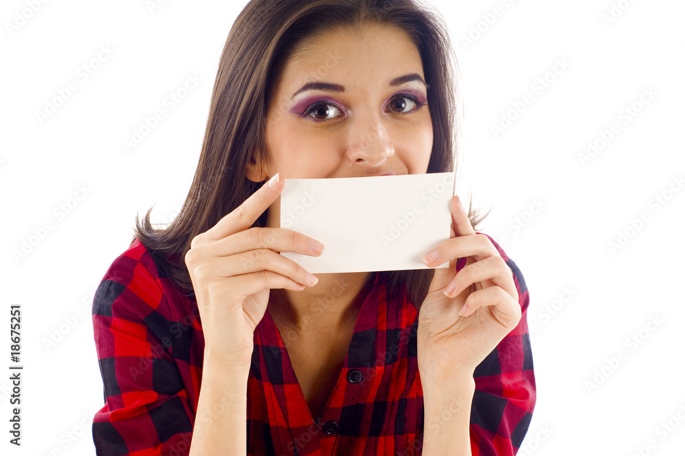 Woman smiling & covering her mouth with a blank card