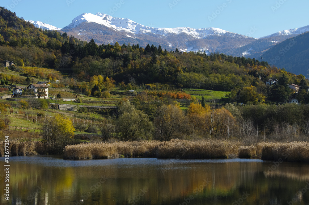 Autumn landscape with lake and mountains