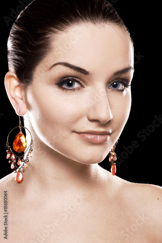 Beautiful woman wearing earrings photo