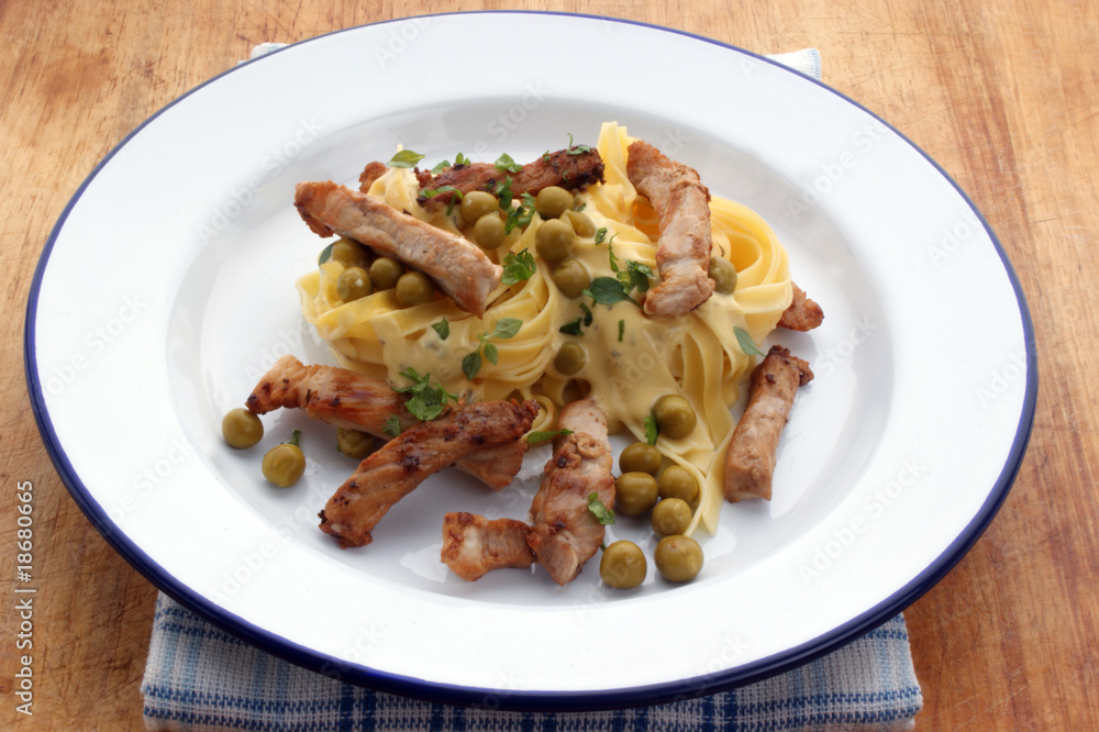 pasta with chicken and organic pea on a plate