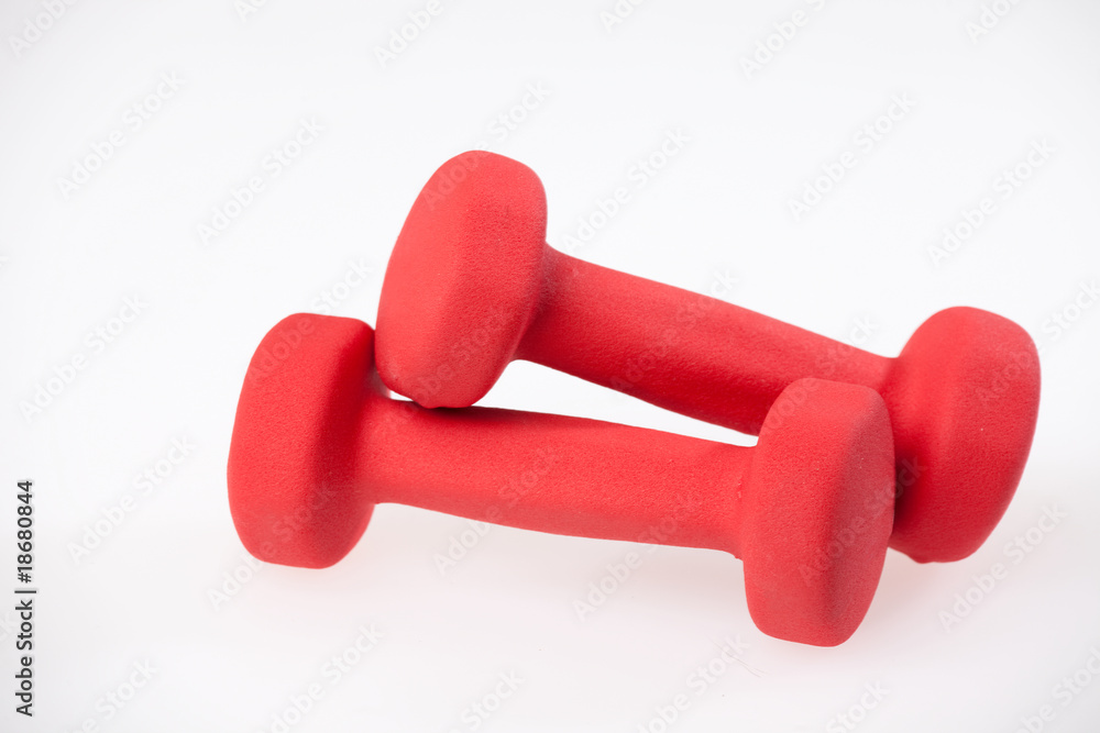 Red dumbbells isolated on a white background Red dumbbells isolated on a white background