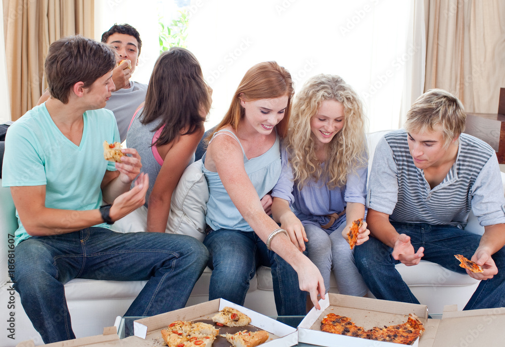 Adolescents eating pizza at home Adolescents eating pizza at home