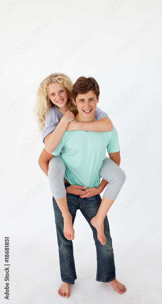 Young boy giving his girlfriend piggyback ride Stock Photo Adobe Stock