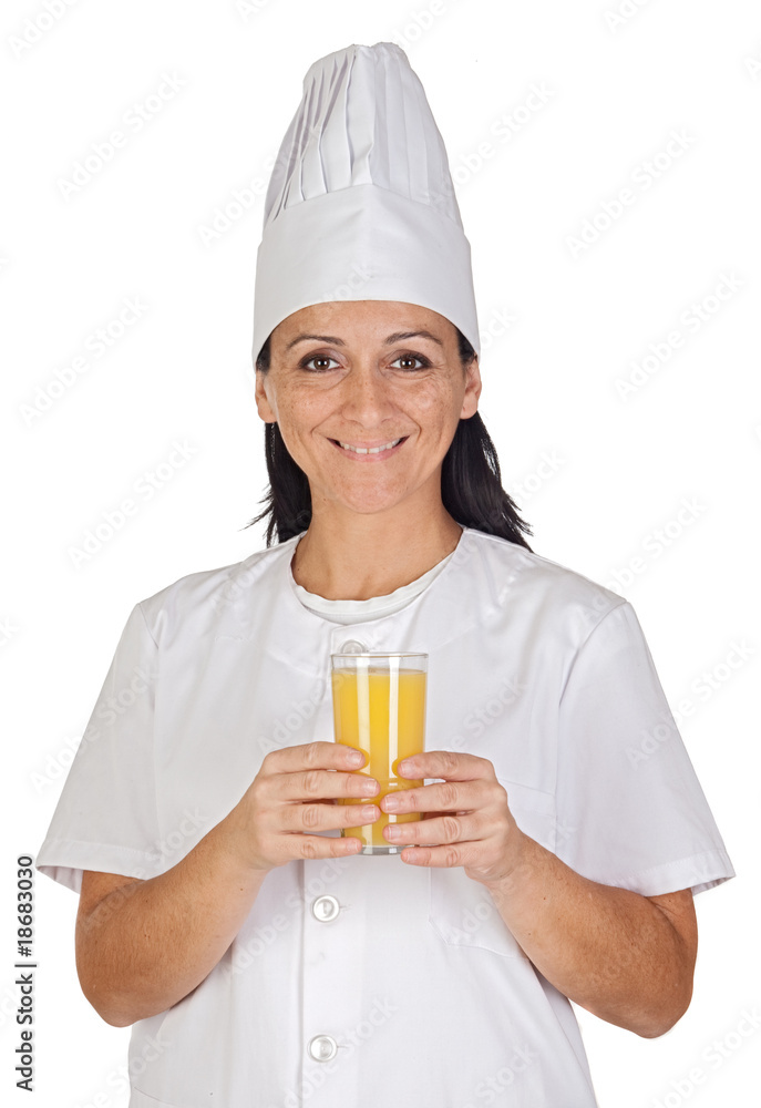 Pretty cook girl with a glass of orange juice Pretty cook girl with a glass of orange juice
