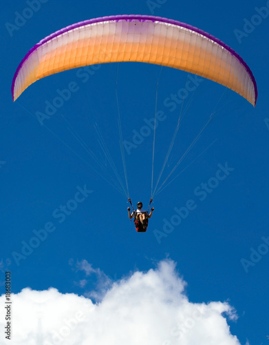 Paraglider above the cloud
