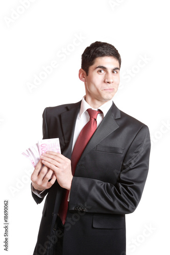 Portrait of a business man holding money