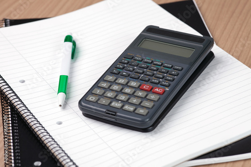 calculator,pen and notebook