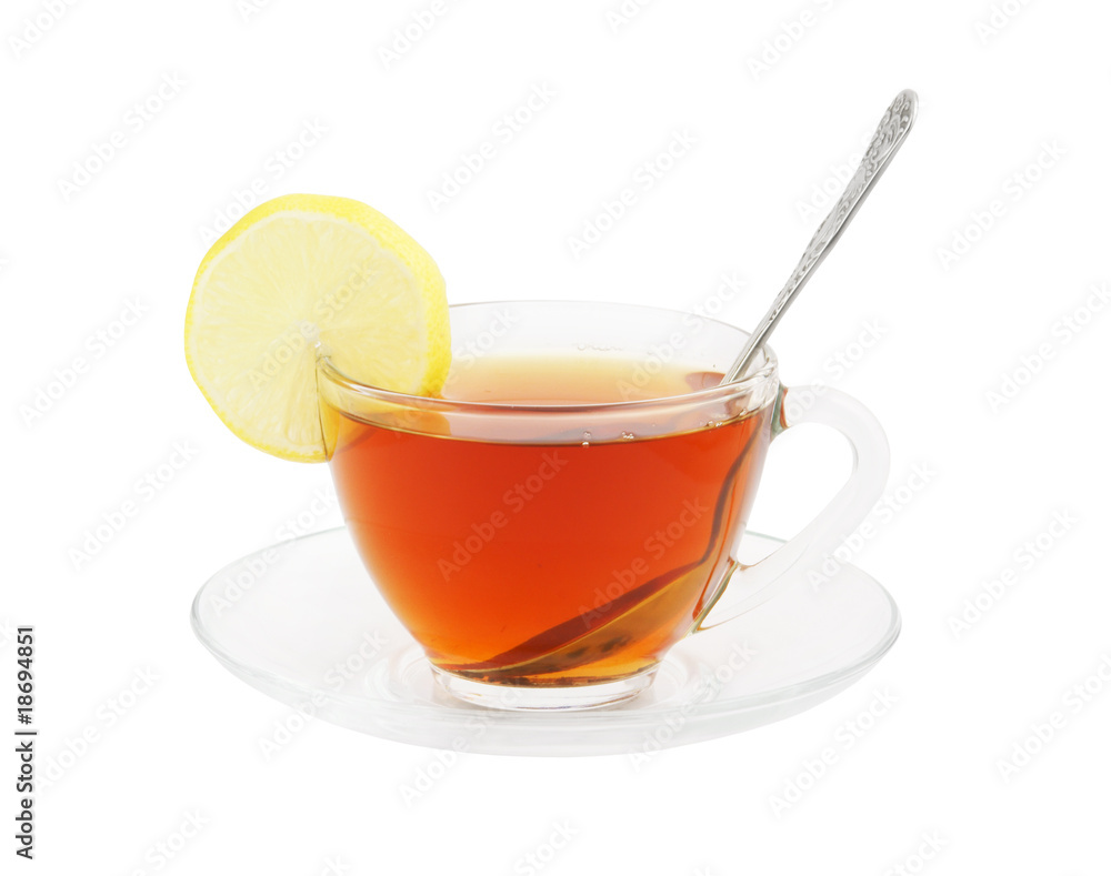 Transparent cup of tea with spoon and lemon isolated on white Transparent cup of tea with spoon and lemon isolated on white