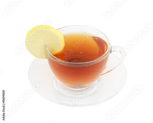 Glass cup of tea with lemon isolated on white