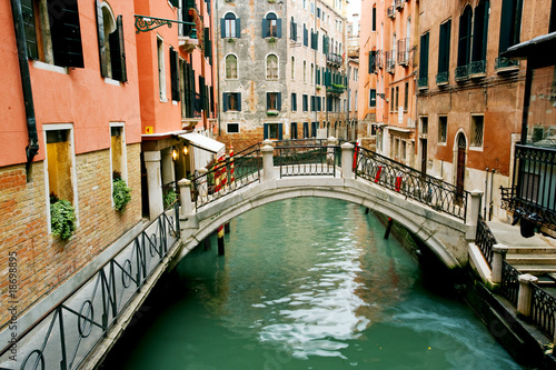 Colorful bridge across canal in Venice, Italy © Natalia Bratslavsky