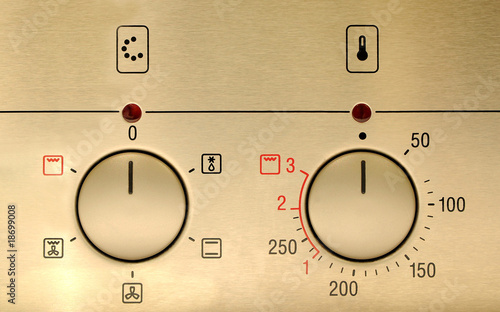 controls from a modern stainless steel oven