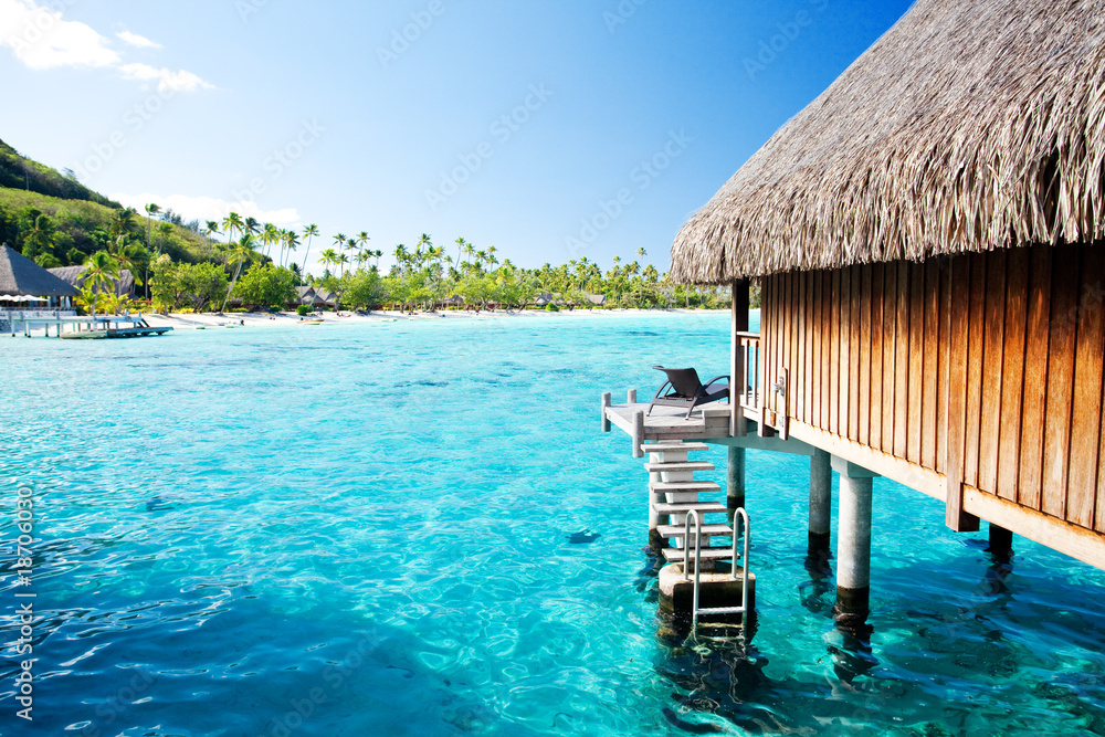 Over water bungalow with steps into amazing lagoon