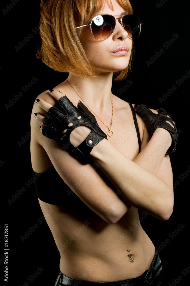 Naklejka premium Beautiful red girl on black