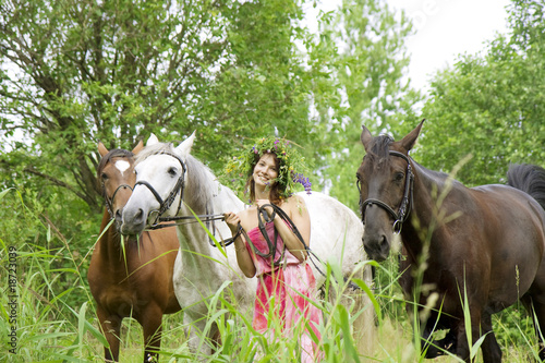 Brunette girl with horses