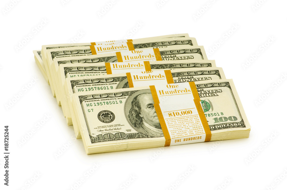 Stack of dollars isolated on the white Stack of dollars isolated on the white