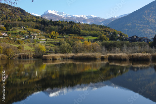 Autumn landscape with lake and mountains