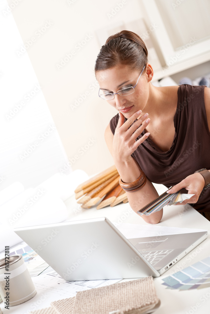 Fototapeta premium Young female designer with color swatch