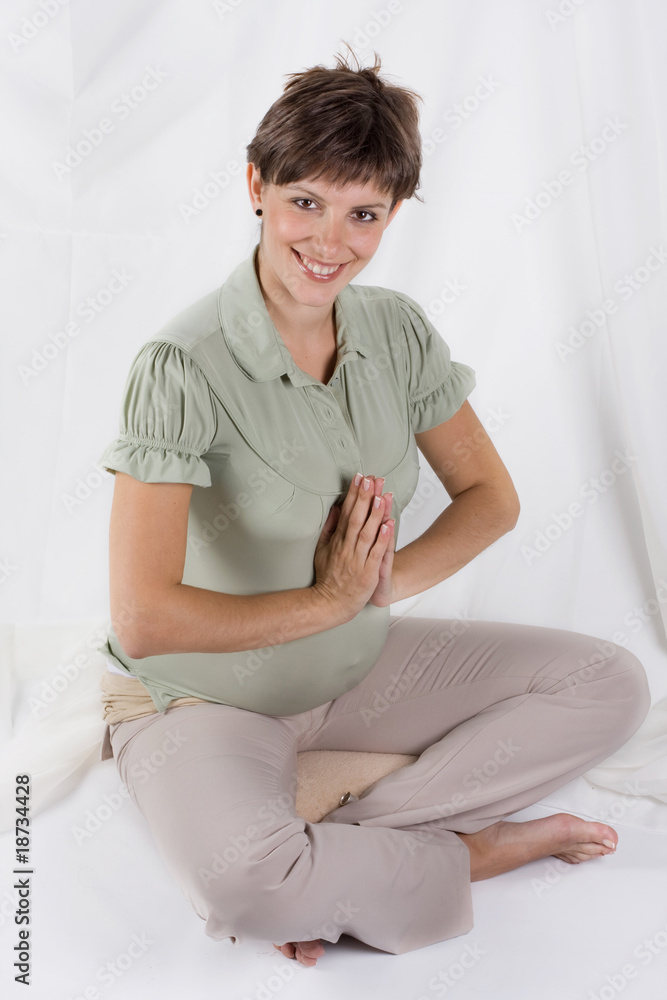pregnant woman doing yoga.