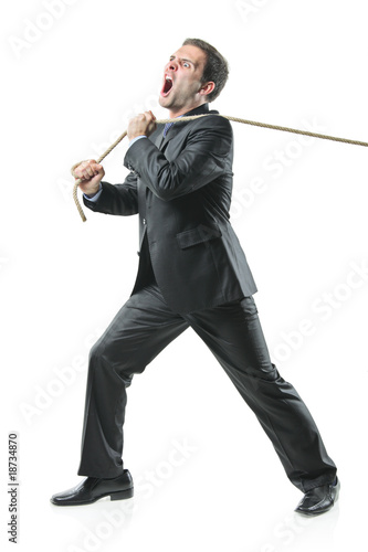 Businessman pulling a rope isolated on white background