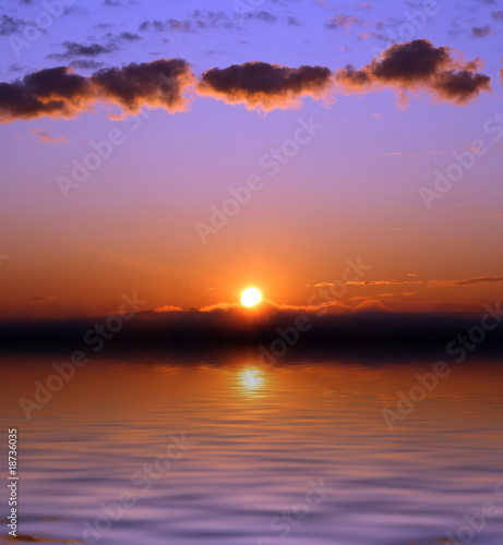 sunrise with clouds over sea