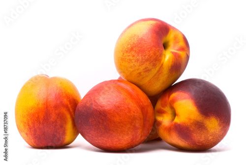 Juicy nectarines on a white background