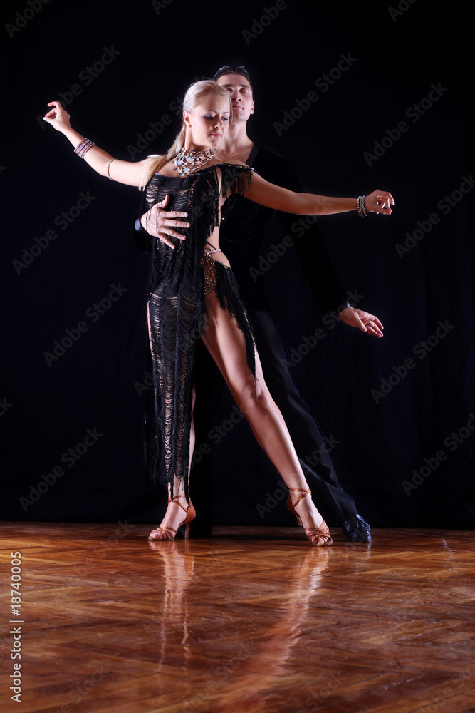 dancers in ballroom against black background dancers in ballroom against black background