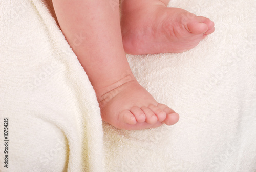 Children's legs on a soft towel